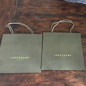 Two Longchamp Olive Green Paper Gift Bags with Yellow Logo from Vienna store
